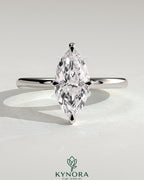 Kynora CJ 2ct marquise claw solitaire engagement ring with hidden halo, showcasing a sparkling marquise diamond and elegant band.