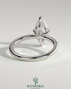 Kynora CJ 2ct marquise claw solitaire engagement ring with hidden halo, showcasing elegant diamond setting and fine craftsmanship.