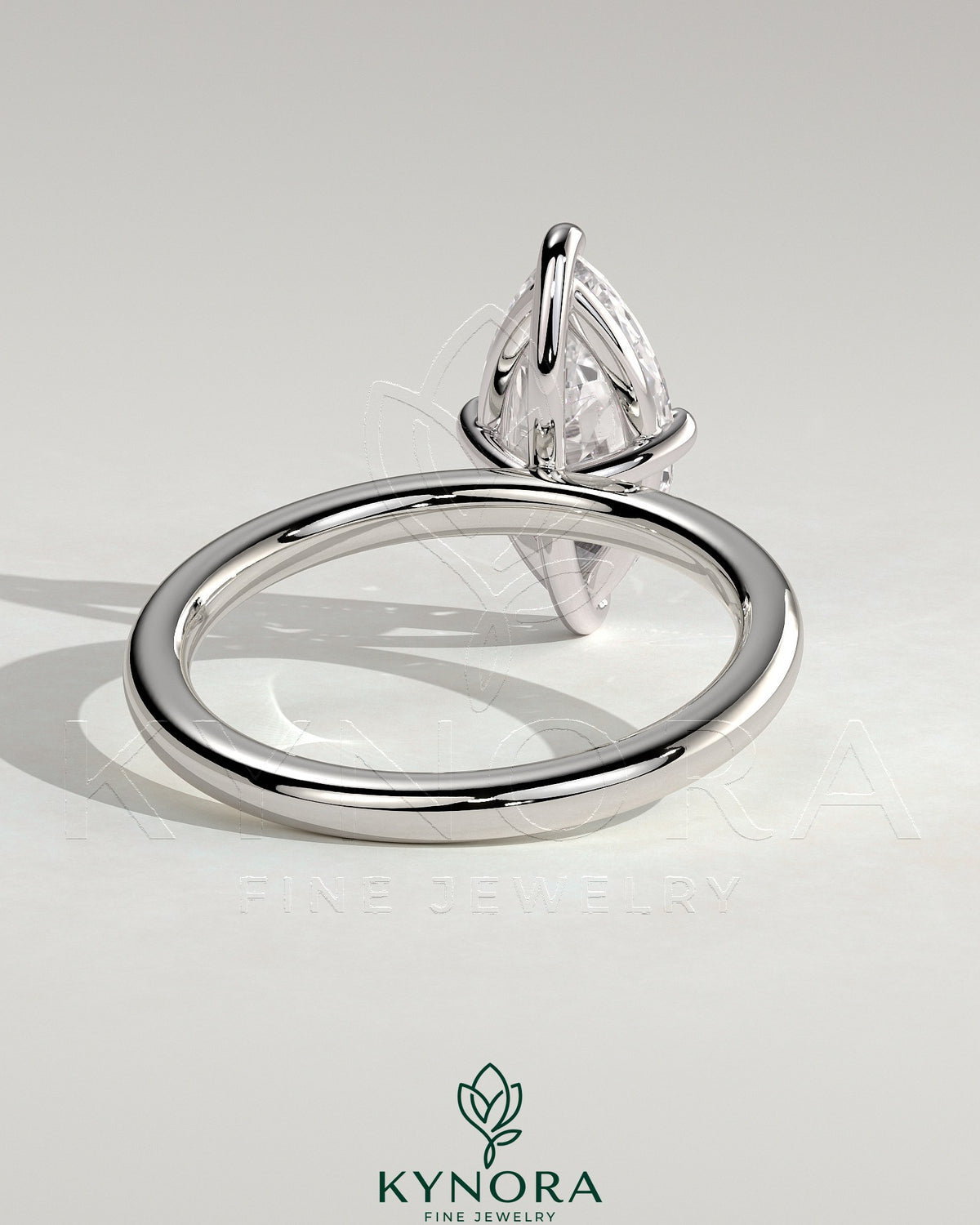 Kynora CJ 2ct marquise claw solitaire engagement ring with hidden halo, showcasing elegant diamond setting and fine craftsmanship.