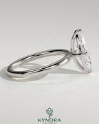 Kynora CJ 2ct marquise claw solitaire engagement ring with hidden halo, showcasing elegant diamond setting and sparkling design.