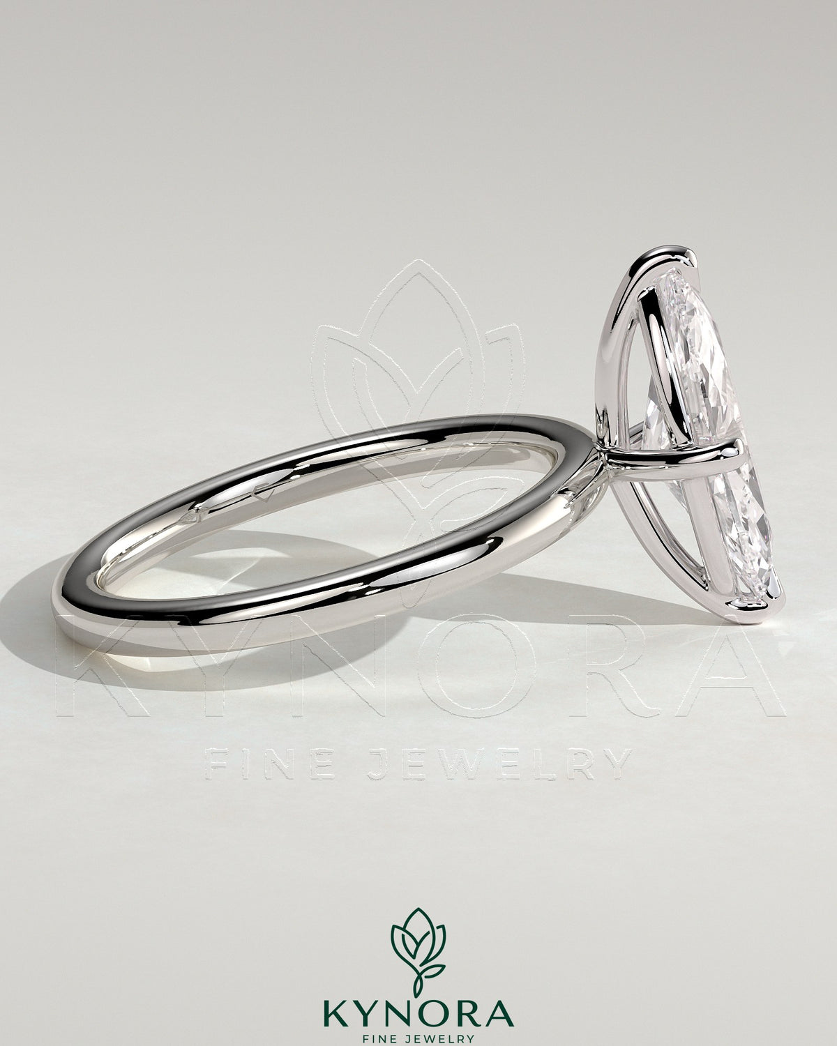 Kynora CJ 2ct marquise claw solitaire engagement ring with hidden halo, showcasing elegant diamond setting and sparkling design.