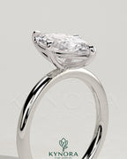 Kynora CJ 2ct marquise solitaire engagement ring with hidden halo, featuring a sleek design and sparkling diamond details.