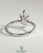 Kynora CJ 2ct marquise solitaire engagement ring with six prongs showcasing a sparkling marquise-cut diamond.