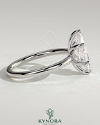 Kynora CJ 2ct marquise-cut solitaire engagement ring with six prongs on a sleek band, showcasing elegant diamond craftsmanship.