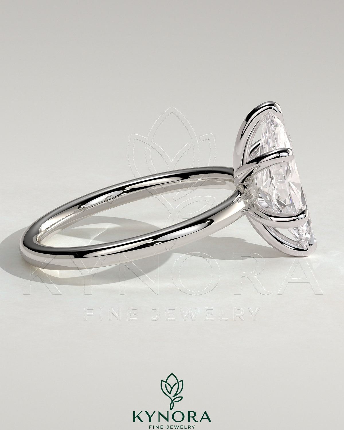 Kynora CJ 2ct marquise-cut solitaire engagement ring with six prongs on a sleek band, showcasing elegant diamond craftsmanship.