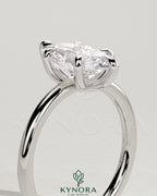Kynora CJ 2ct marquise diamond solitaire engagement ring with six-prong setting and claw design, showcasing elegant jewelry craftsmanship.