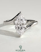 Kynora CJ 2ct marquise claw solitaire engagement ring with bypass band, showcasing a sparkling marquise-cut diamond and sleek band design.