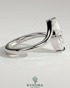 Kynora CJ 2ct marquise claw solitaire engagement ring with bypass band, featuring a sparkling marquise-cut diamond.