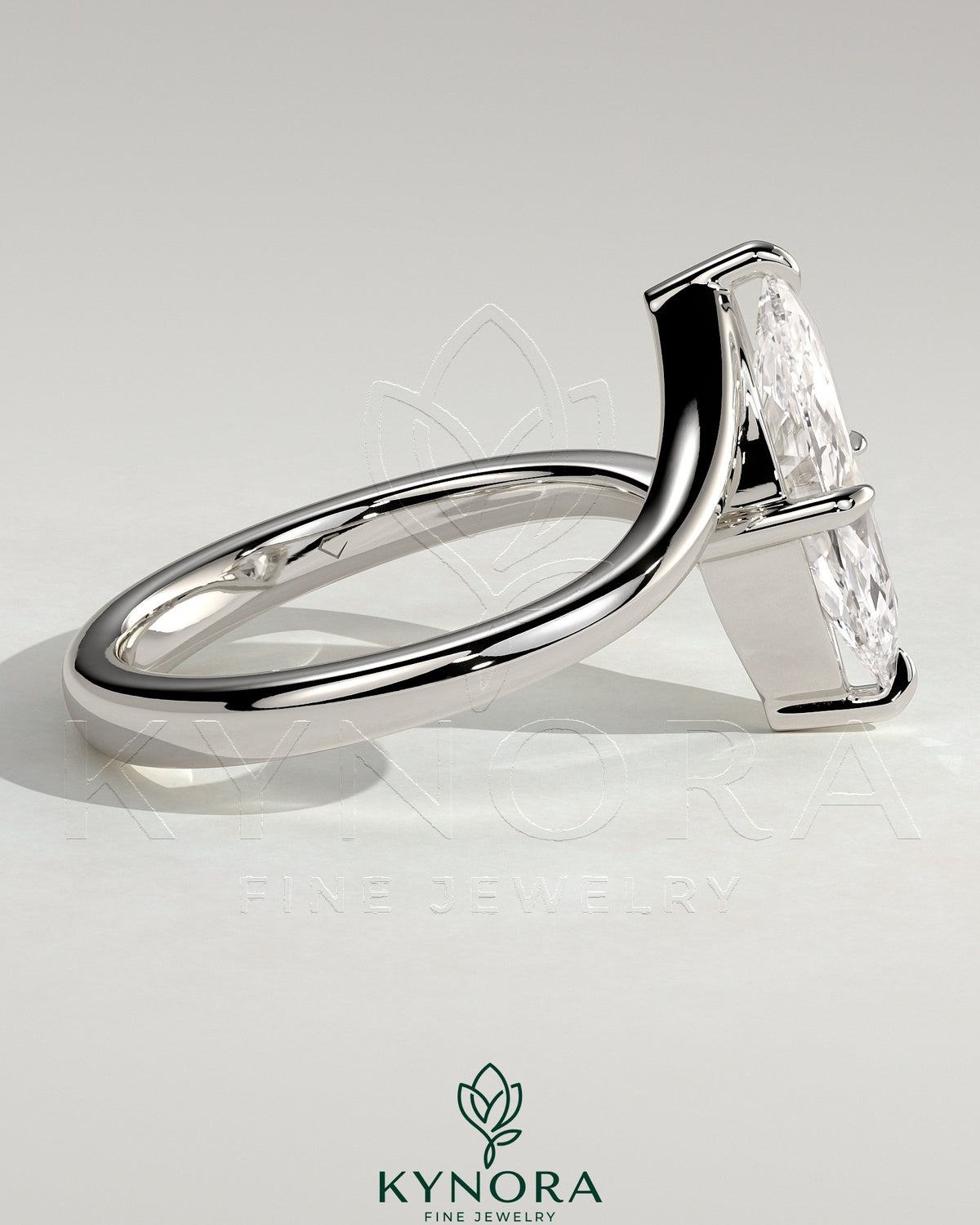 Kynora CJ 2ct marquise claw solitaire engagement ring with bypass band, featuring a sparkling marquise-cut diamond.
