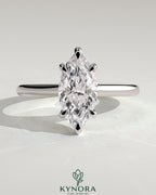 Kynora CJ 2ct marquise claw solitaire engagement ring with cathedral high setting, showcasing a sparkling marquise diamond.