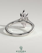 Kynora CJ 2ct marquise solitaire engagement ring with cathedral high setting, showcasing a sparkling marquise diamond on a sleek band.