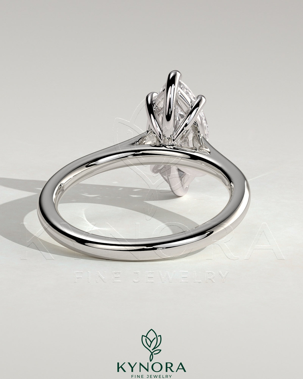 Kynora CJ 2ct marquise solitaire engagement ring with cathedral high setting, showcasing a sparkling marquise diamond on a sleek band.