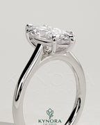 Kynora CJ 2ct marquise claw solitaire engagement ring with cathedral high setting, showcasing sparkling diamond and elegant design.