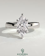 Kynora CJ 2ct marquise diamond claw solitaire engagement ring with cigar band and hidden halo setting.
