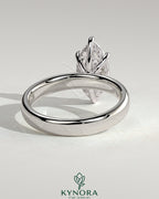 Kynora CJ 2ct marquise claw solitaire engagement ring with cigar band and hidden halo, showcasing sparkling diamond design.