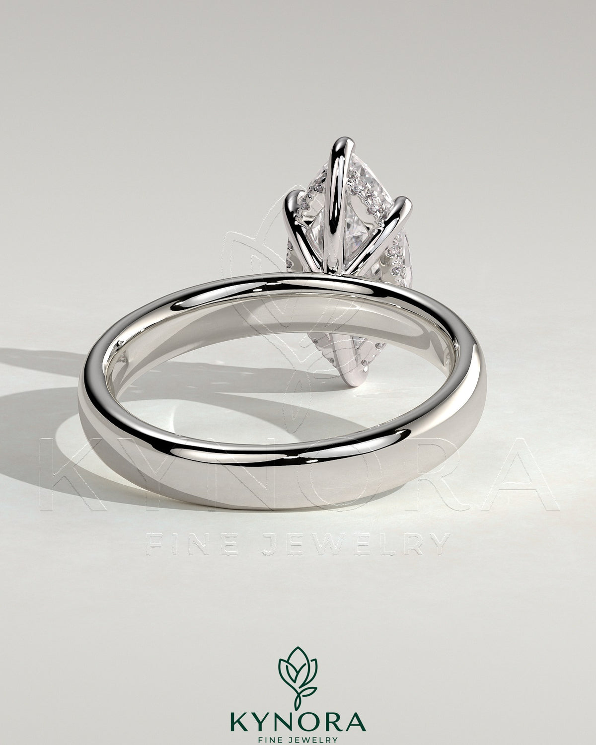 Kynora CJ 2ct marquise claw solitaire engagement ring with cigar band and hidden halo, showcasing sparkling diamond design.