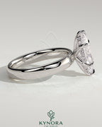 Kynora CJ 2ct marquise claw solitaire engagement ring with cigar band and hidden halo, showcasing intricate metalwork and sparkling diamond.