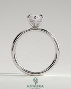 Kynora CJ 2-carat marquise claw solitaire engagement ring with cigar band and hidden halo, showcasing sparkling diamond details.