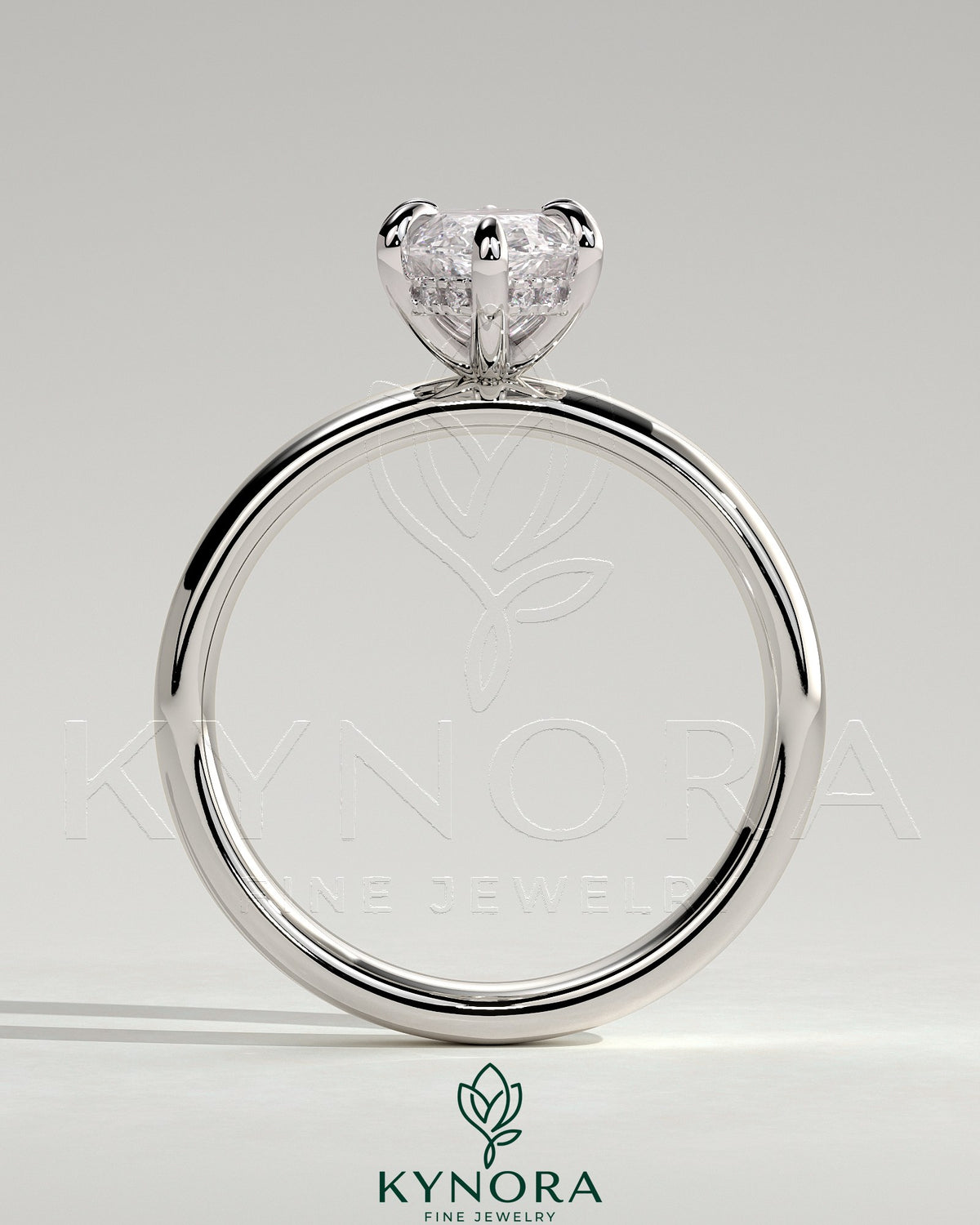 Kynora CJ 2-carat marquise claw solitaire engagement ring with cigar band and hidden halo, showcasing sparkling diamond details.