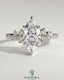 Kynora CJ 2ct marquise solitaire engagement ring with clustered round shoulder stones, crafted in elegant jewelry style.