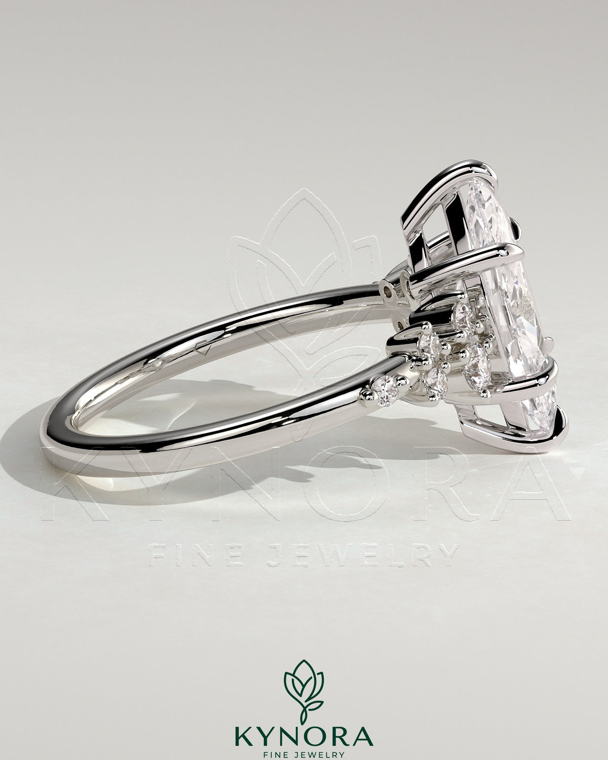 Kynora CJ 2ct marquise solitaire engagement ring with clustered round shoulder stones and elegant design.