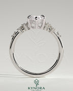 Kynora CJ 2ct marquise claw solitaire engagement ring with clustered round shoulder stones, showcasing elegant jewelry craftsmanship.