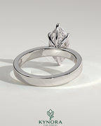Kynora CJ 2ct marquise claw solitaire engagement ring with flat cigar band and hidden halo, showcasing sparkling diamond details.