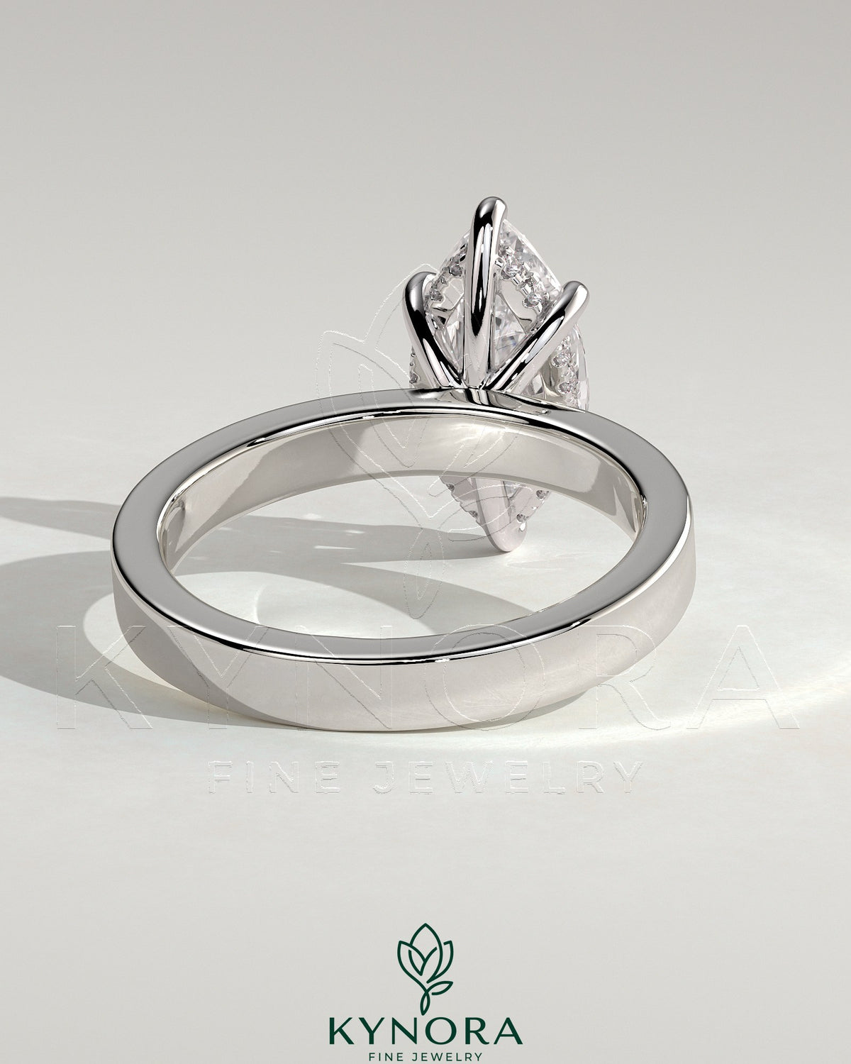 Kynora CJ 2ct marquise claw solitaire engagement ring with flat cigar band and hidden halo, showcasing sparkling diamond details.
