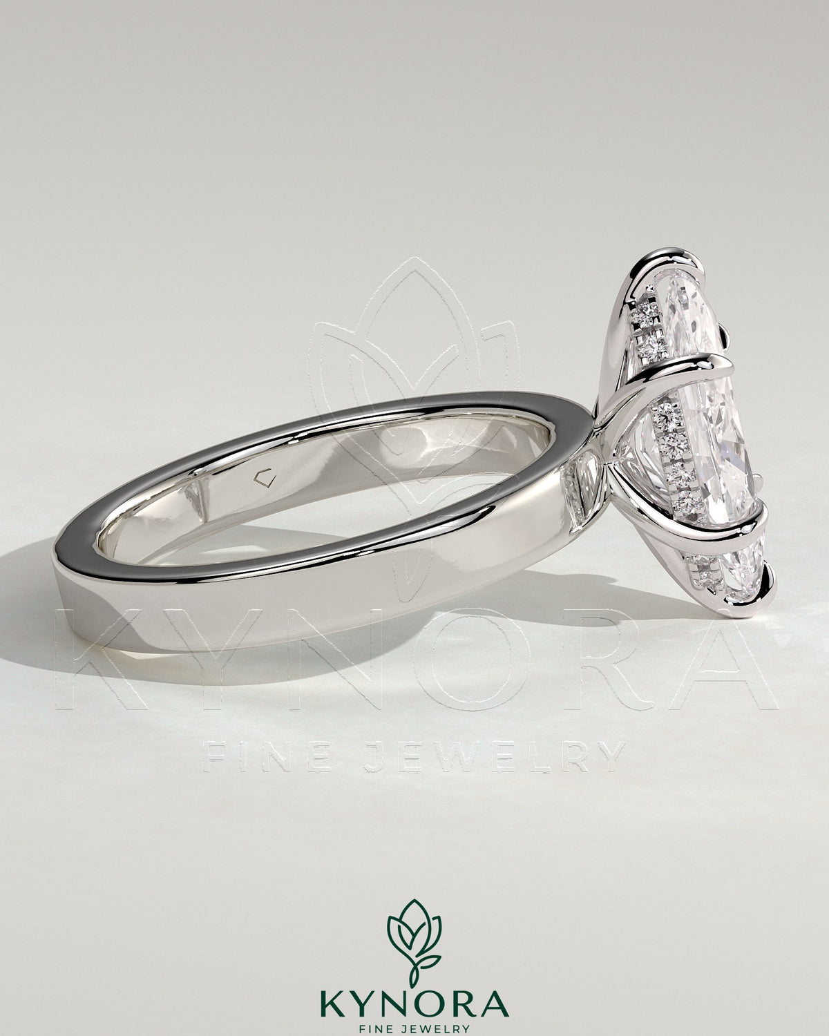 Kynora CJ 2ct marquise claw solitaire engagement ring with flat cigar band and hidden halo, showcasing a sparkling gemstone setting.