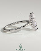Kynora CJ 2ct marquise cut solitaire engagement ring with hidden halo and cathedral high setting, showcasing elegant jewelry craftsmanship.
