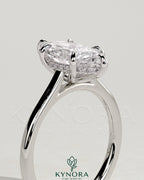Kynora CJ 2ct marquise solitaire engagement ring with hidden halo and cathedral high setting, showcasing intricate design details.