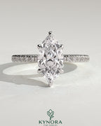 Kynora CJ 2ct marquise cut solitaire engagement ring with hidden halo and pave band, showcasing elegant diamond setting.