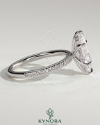 Kynora CJ 2ct marquise claw solitaire engagement ring with hidden halo and pave band, showcasing elegant diamond design.