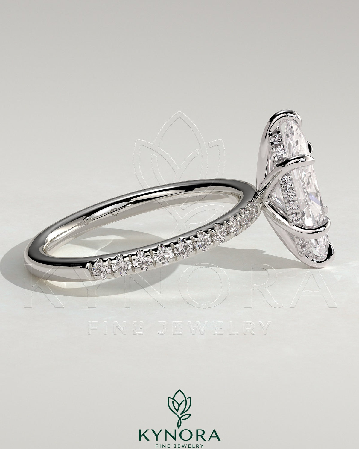 Kynora CJ 2ct marquise claw solitaire engagement ring with hidden halo and pave band, showcasing elegant diamond design.