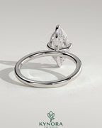 Kynora CJ 2ct marquise diamond claw engagement ring with hidden halo and four-prong setting, showcasing elegant jewelry design.