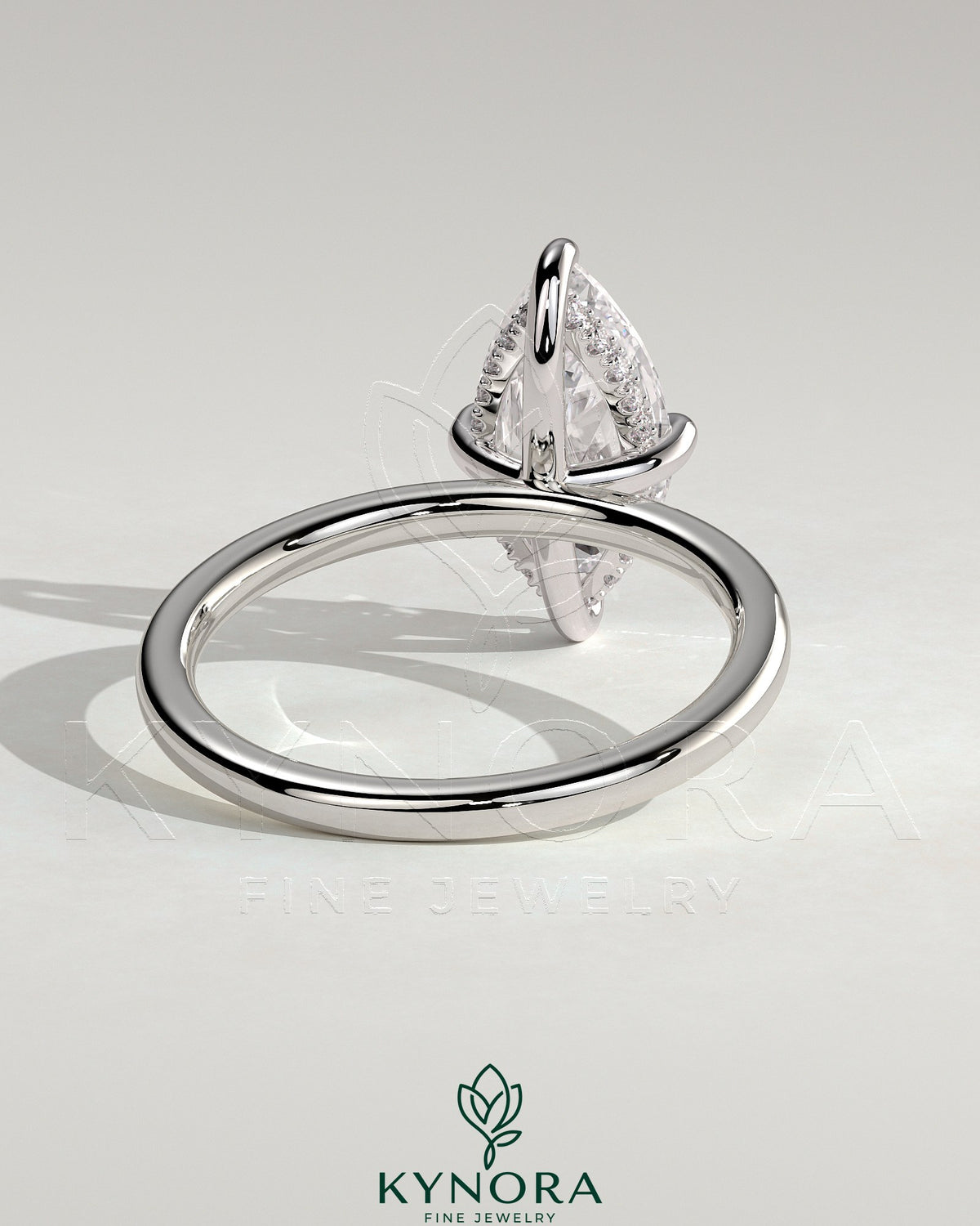 Kynora CJ 2ct marquise diamond claw engagement ring with hidden halo and four-prong setting, showcasing elegant jewelry design.