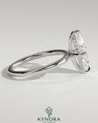 Kynora CJ 2ct marquise cut solitaire engagement ring with hidden halo and four-prong setting, showcasing elegant jewelry craftsmanship.