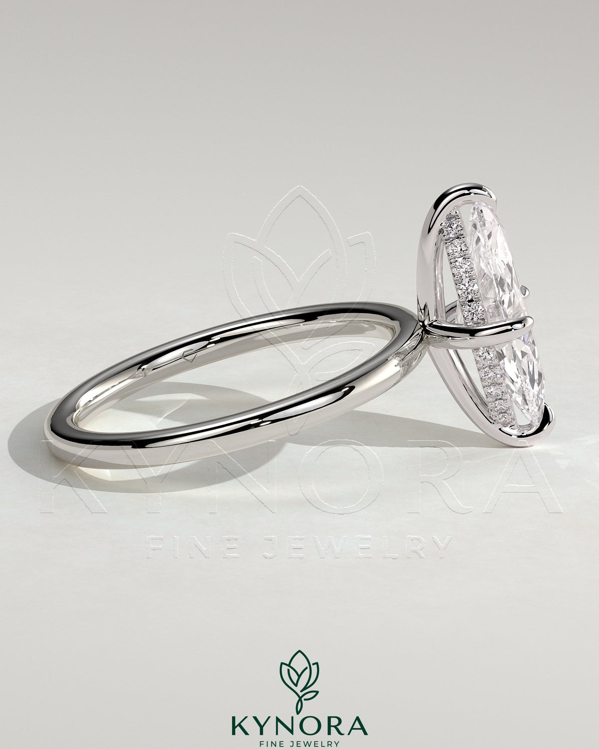 Kynora CJ 2ct marquise cut solitaire engagement ring with hidden halo and four-prong setting, showcasing elegant jewelry craftsmanship.