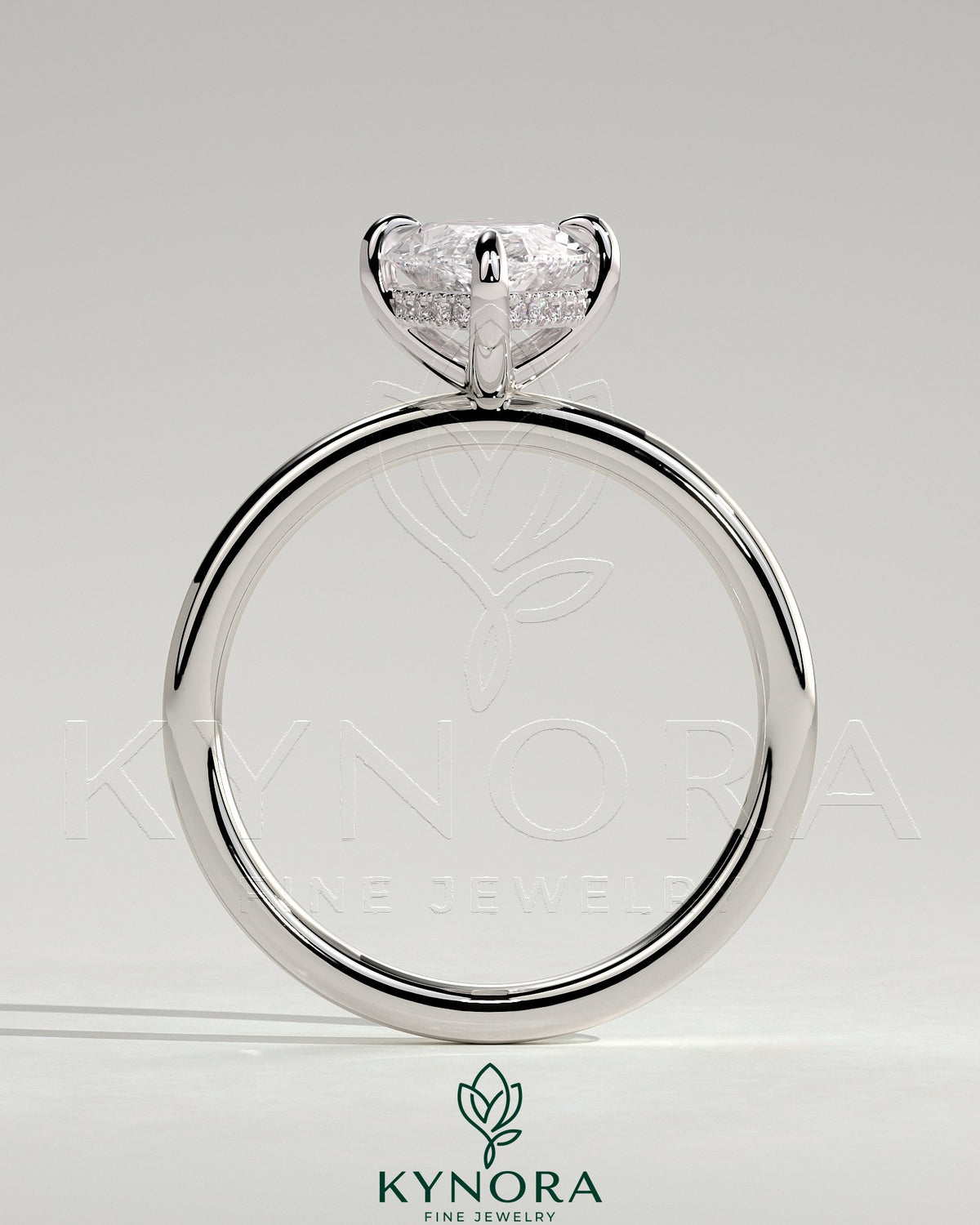 Kynora CJ 2ct marquise claw solitaire engagement ring with hidden halo and four prongs, showcasing elegant diamond setting.