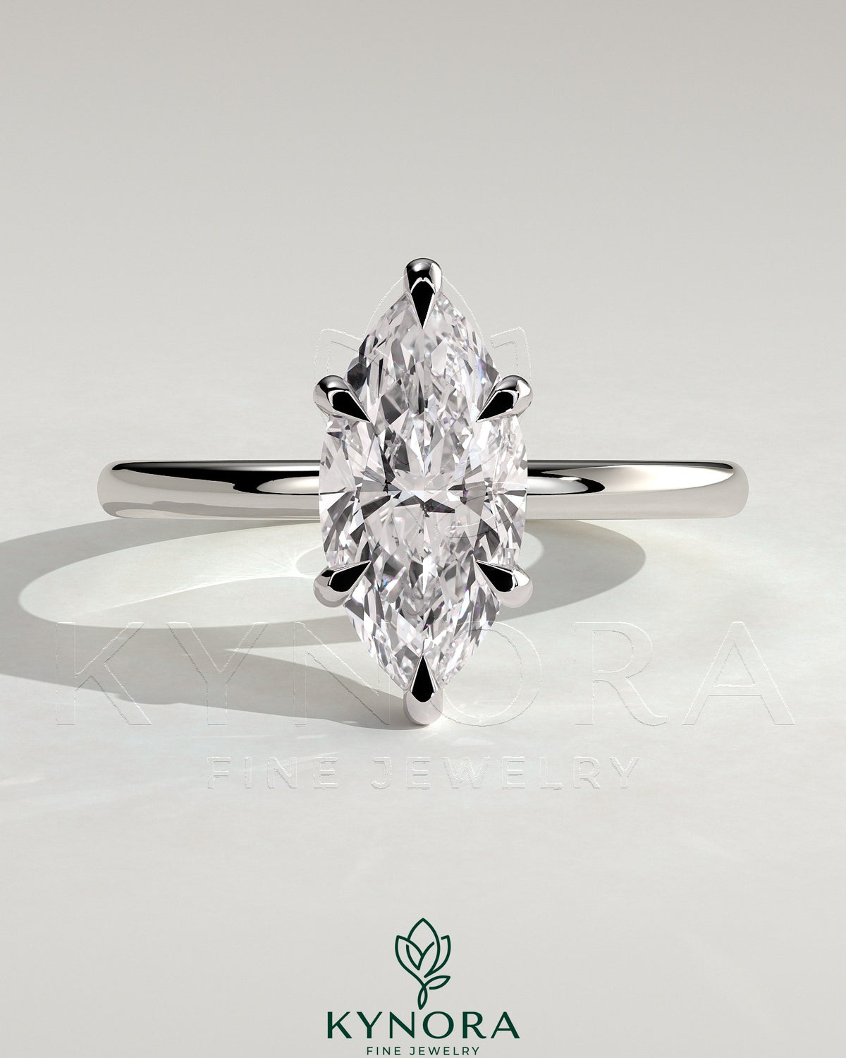 Kynora CJ 2ct marquise diamond solitaire engagement ring with hidden halo and six prong setting on a silver band.
