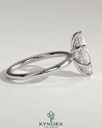Kynora CJ 2ct marquise diamond solitaire engagement ring with hidden halo and six prong setting, elegant jewelry design.