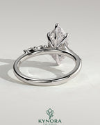 Kynora CJ 2ct marquise claw solitaire engagement ring with hidden halo, opposing marquise accents, cathedral high setting.