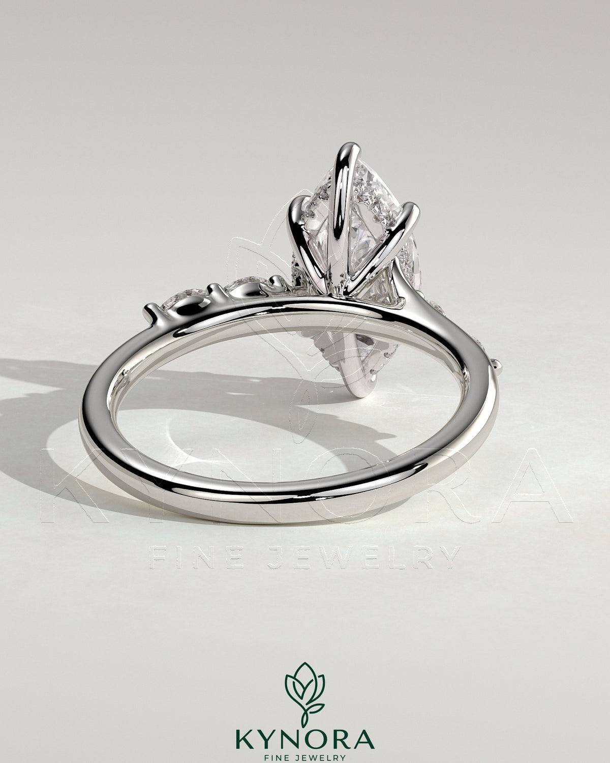 Kynora CJ 2ct marquise claw solitaire engagement ring with hidden halo, opposing marquise accents, cathedral high setting.