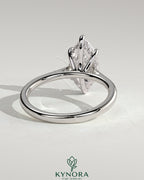 Kynora CJ 2ct marquise claw solitaire engagement ring with hidden halo, tapered band, cathedral high setting, and elegant design