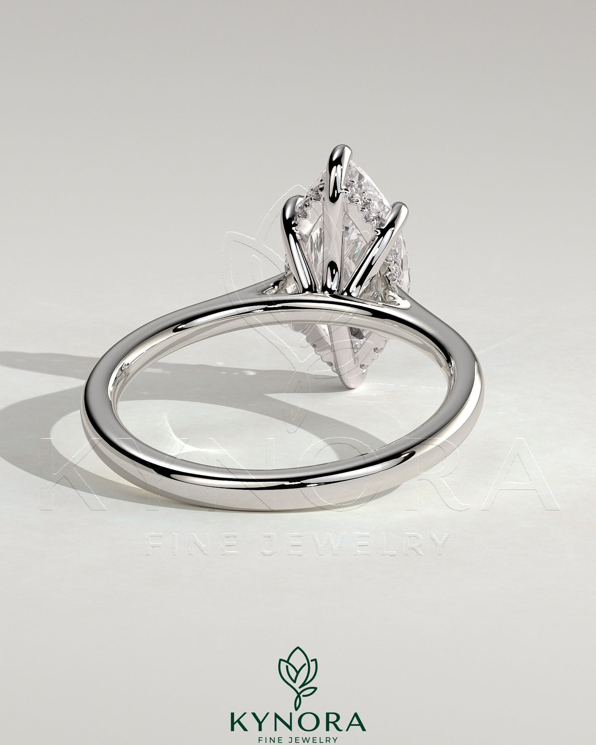 Kynora CJ 2ct marquise claw solitaire engagement ring with hidden halo, tapered band, cathedral high setting, and elegant design