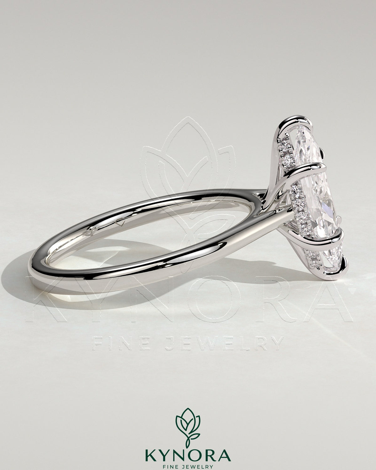 Kynora CJ 2ct marquise claw solitaire engagement ring with hidden halo, tapered band, and cathedral high setting in jewelry image.