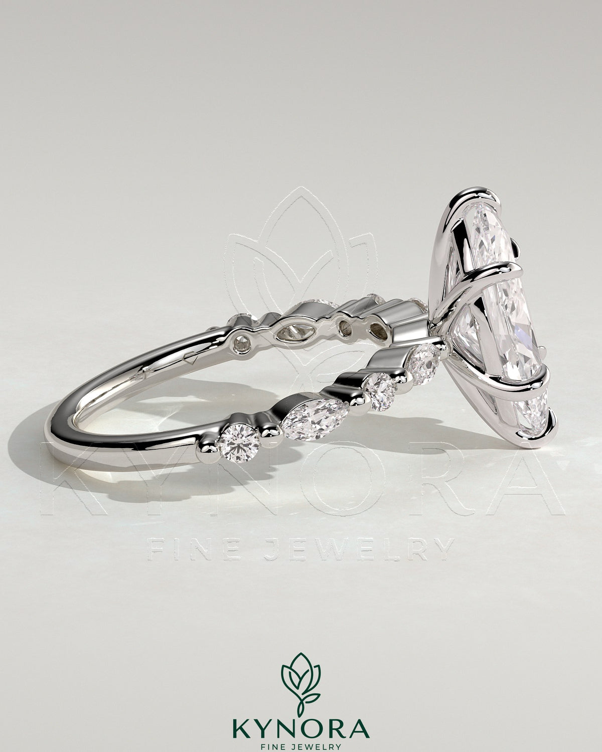 Kynora CJ 2ct marquise claw solitaire engagement ring with marquise and round accent stones, elegant and sparkling jewelry piece