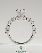 Kynora CJ 2ct marquise claw solitaire engagement ring with marquise and round accent stones, showcasing elegant jewelry design.