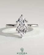 Kynora CJ 2ct marquise claw solitaire engagement ring with petal gallery and accent leaf details, crafted in elegant gold.