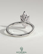 Kynora CJ 2ct marquise claw solitaire engagement ring with petal gallery and leaf accents, elegant and detailed jewelry design.